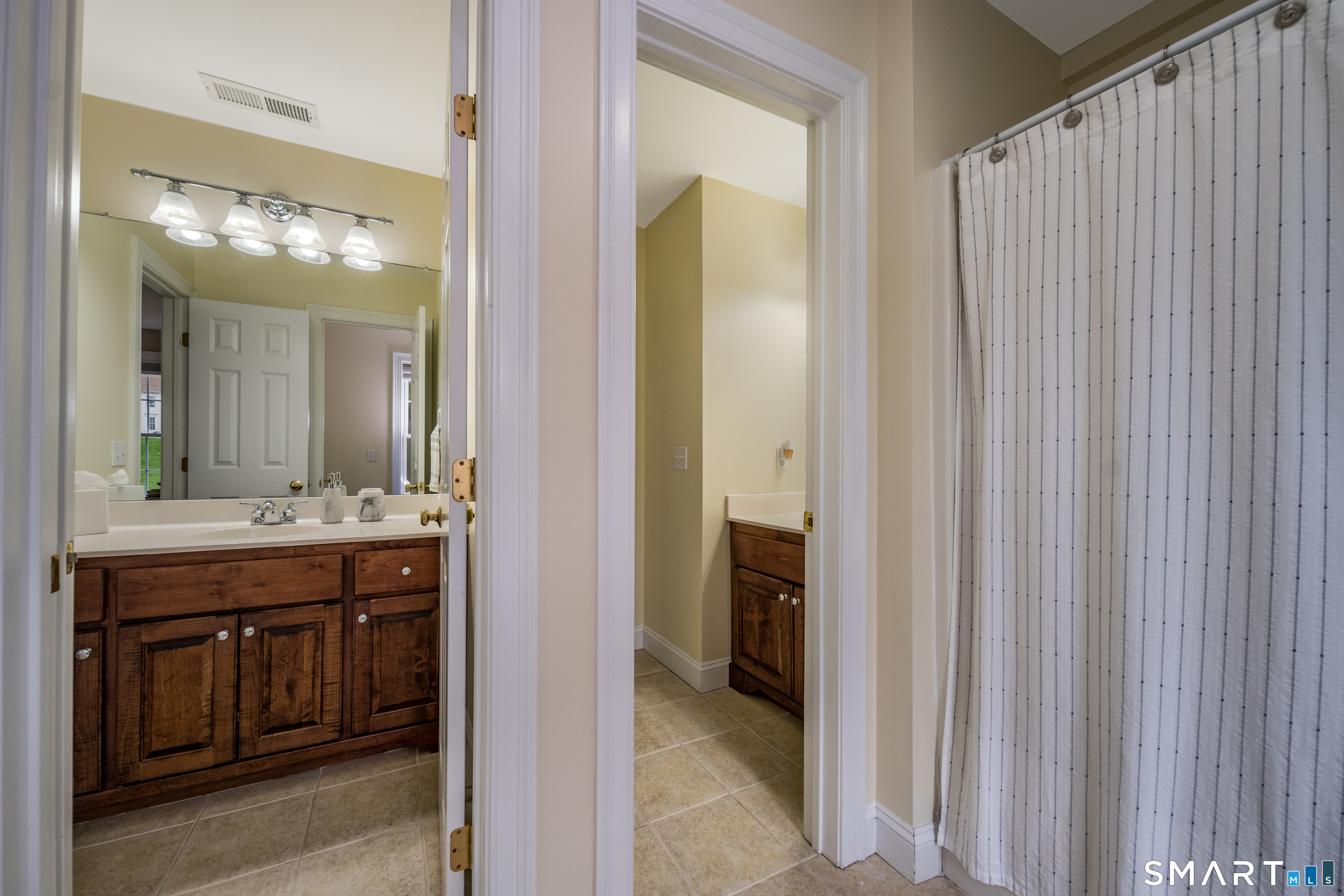 4 Collins View Road Canton, CT 06019 - Photo 25 of 38 a bathroom with a sink and a mirror