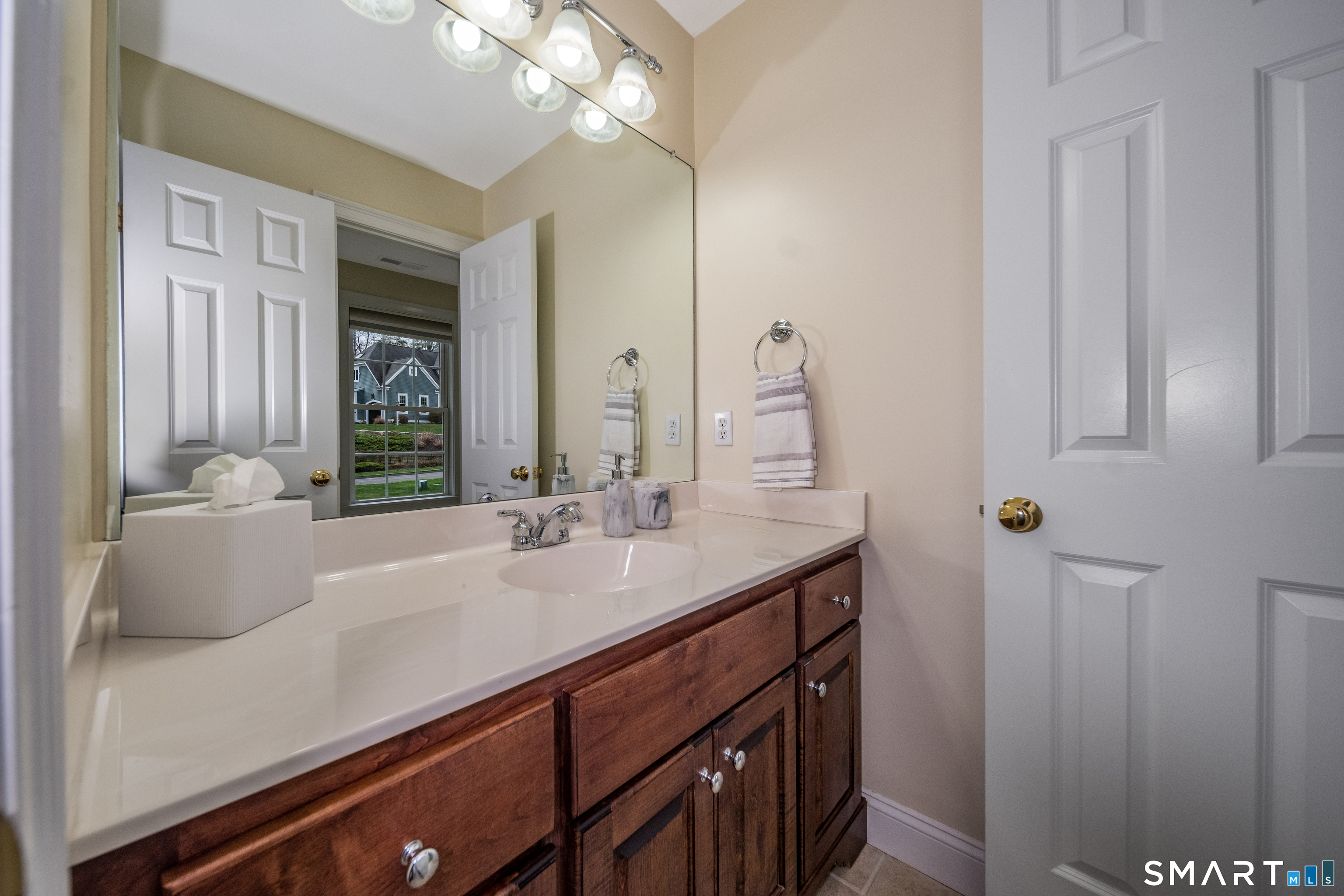 4 Collins View Road Canton, CT 06019 - Photo 26 of 38 a bathroom with a sink and a mirror