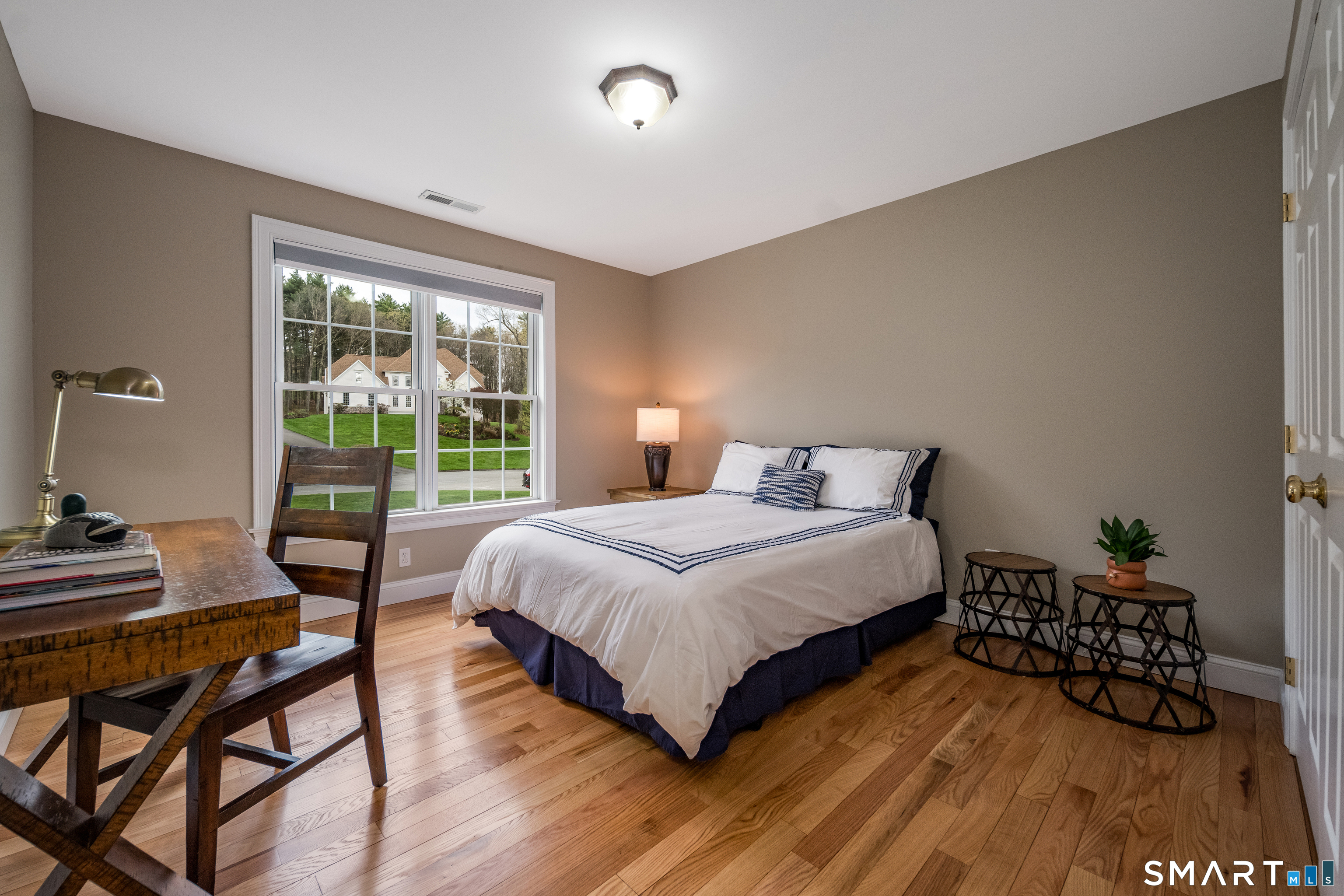 4 Collins View Road Canton, CT 06019 - Photo 27 of 38 a bedroom with a bed and wooden floor