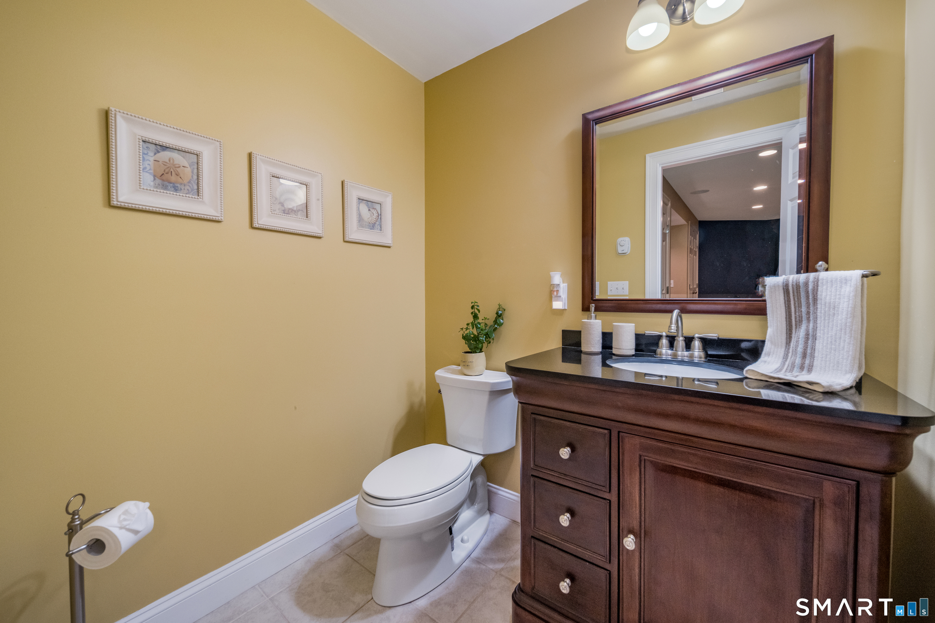 4 Collins View Road Canton, CT 06019 - Photo 33 of 38 a bathroom with a toilet sink and mirror