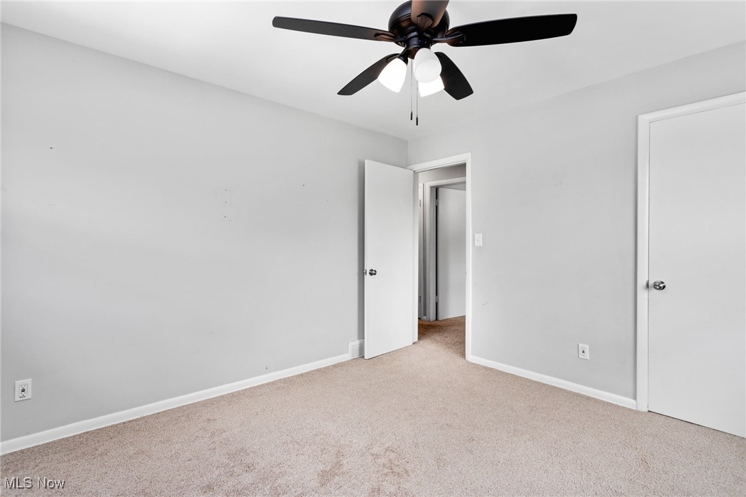 7654 Ragall Parkway Cleveland, OH 44130 - Photo 14 of 33 Unfurnished bedroom featuring light colored carpet and a ceiling fan