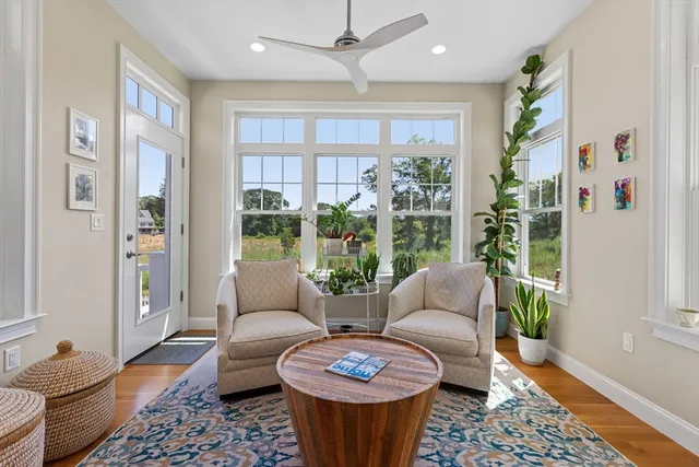 a living room with furniture and a large window