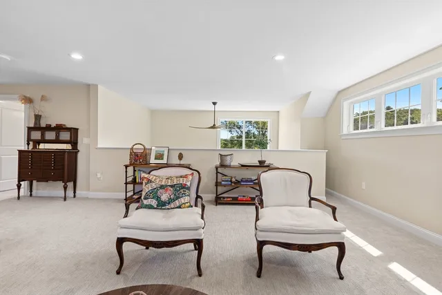 a bedroom with furniture and a window