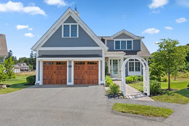 a front view of a house with a yard and porch