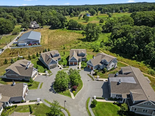 an aerial view of house with yard swimming pool and outdoor seating