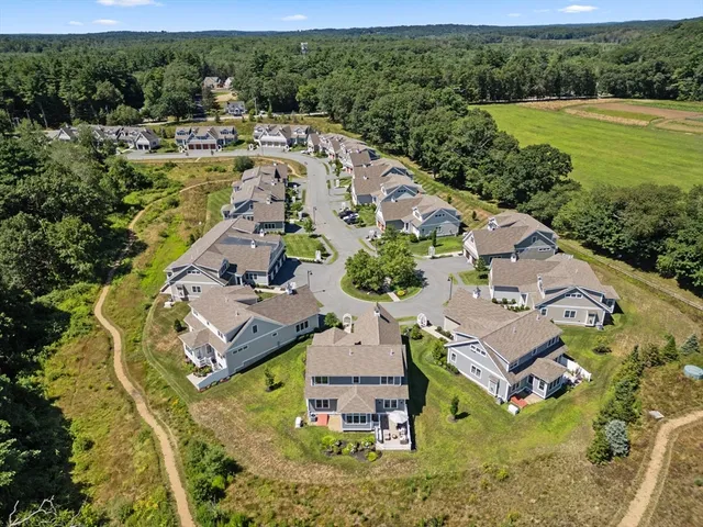 an aerial view of a house with a garden