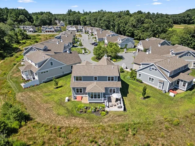 an aerial view of residential house with outdoor space and swimming pool