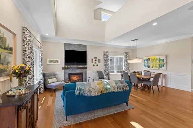 a living room with fireplace furniture and a flat screen tv