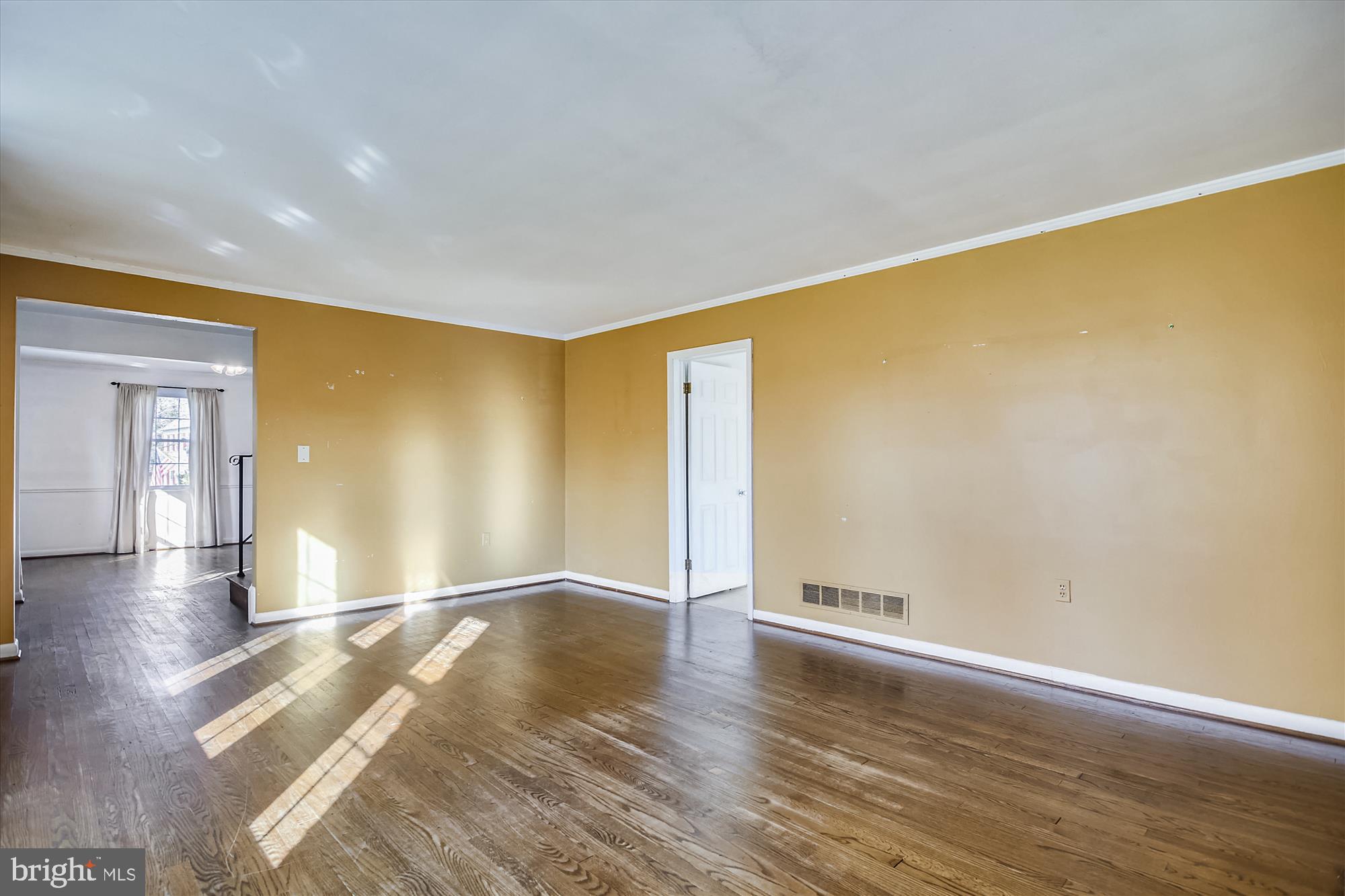 818 Stoneleigh Road Baltimore, MD 21212 - Photo 8 of 35 Living room leads to foyer and den.