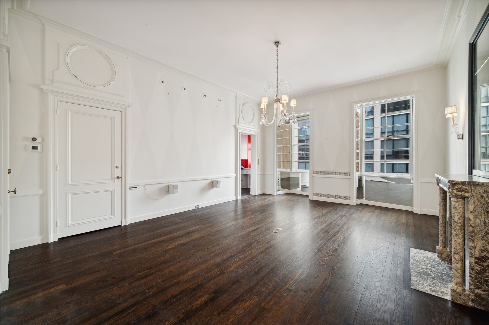 1260 North Astor Street, Unit 8 Chicago, IL 60610 - Photo 14 of 27 a view of empty room with wooden floor and fan
