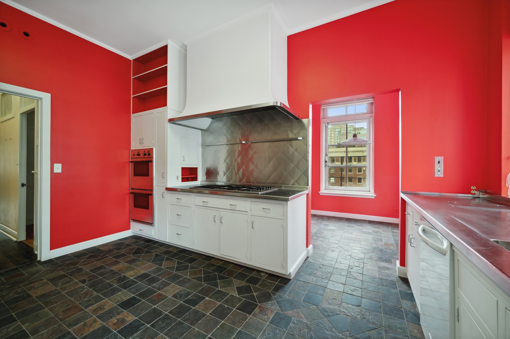 1260 North Astor Street, Unit 8 Chicago, IL 60610 - Photo 17 of 27 a kitchen that has a sink and a stove