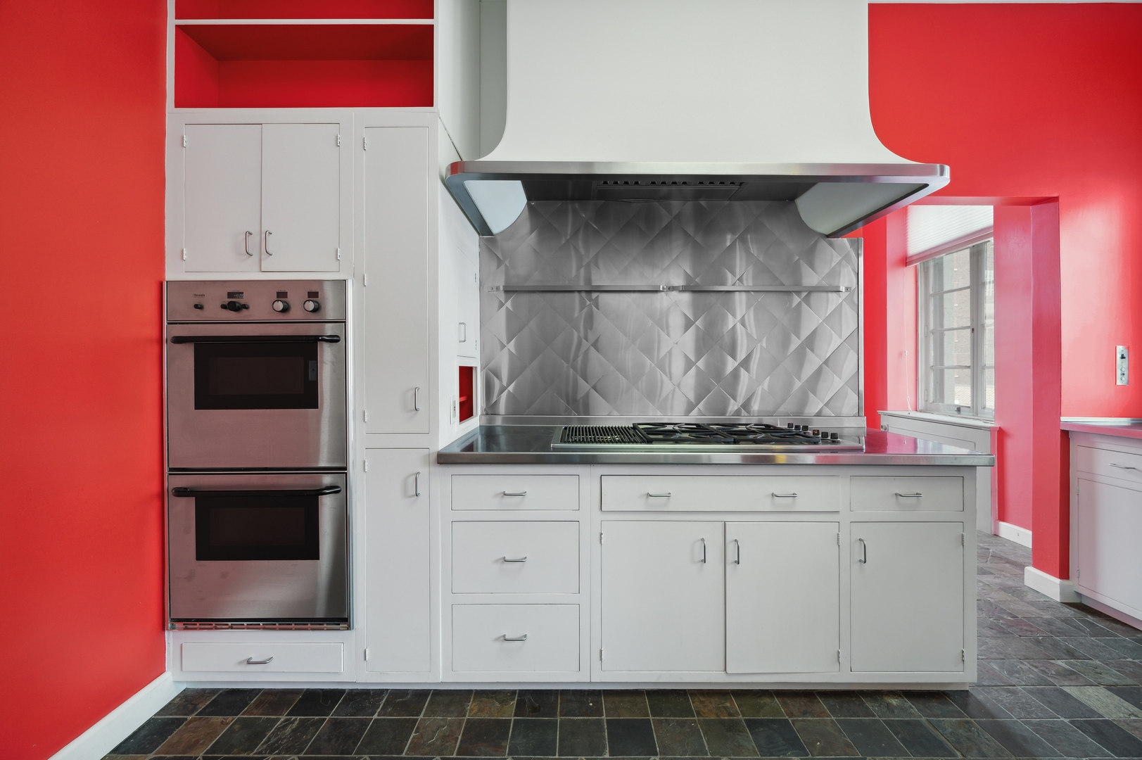 1260 North Astor Street, Unit 8 Chicago, IL 60610 - Photo 18 of 27 a kitchen with stainless steel appliances a stove and a microwave
