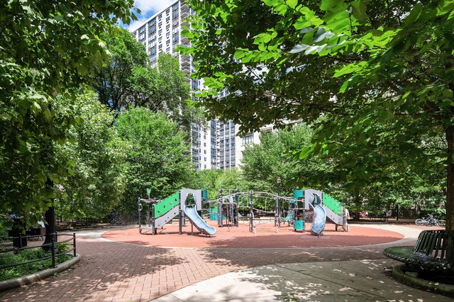 1260 North Astor Street, Unit 8 Chicago, IL 60610 - Photo 25 of 27 a view of a park with swings and slides