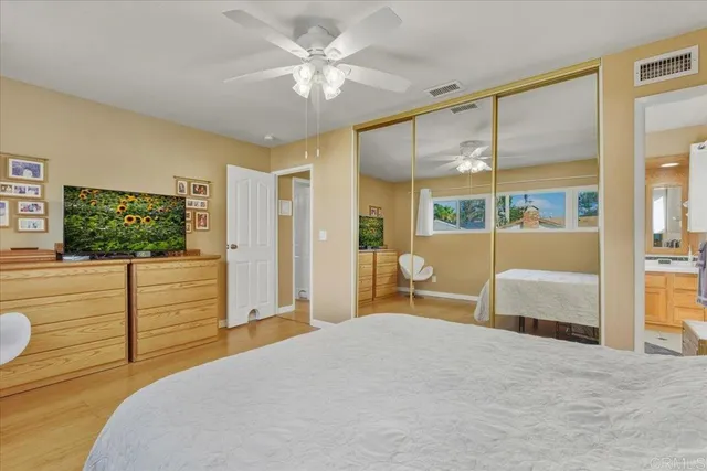 a bedroom with a large bed and a window