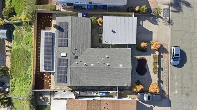 an aerial view of houses with outdoor space