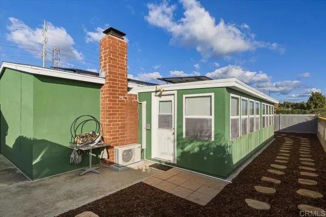 a view of a chair and table in the balcony