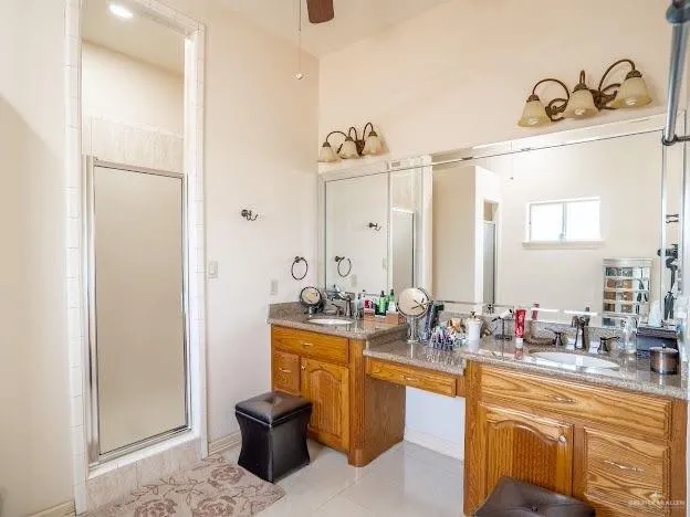 a bathroom with a sink double vanity and mirror