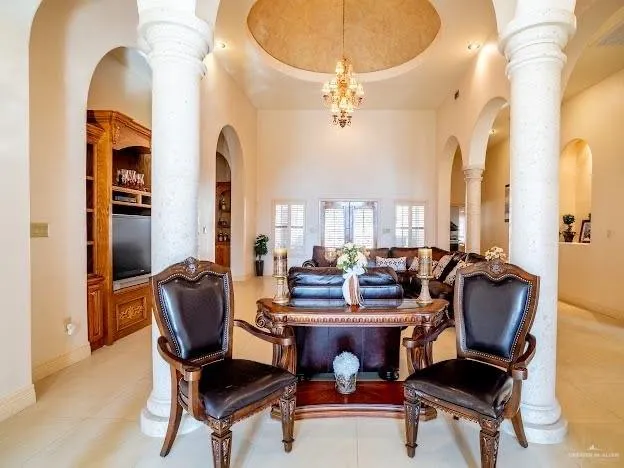 a view of a livingroom with furniture and a gym
