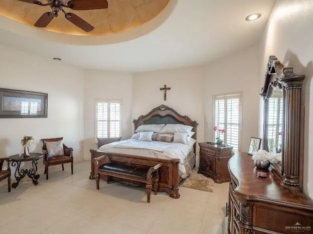 a bedroom with furniture and a chandelier