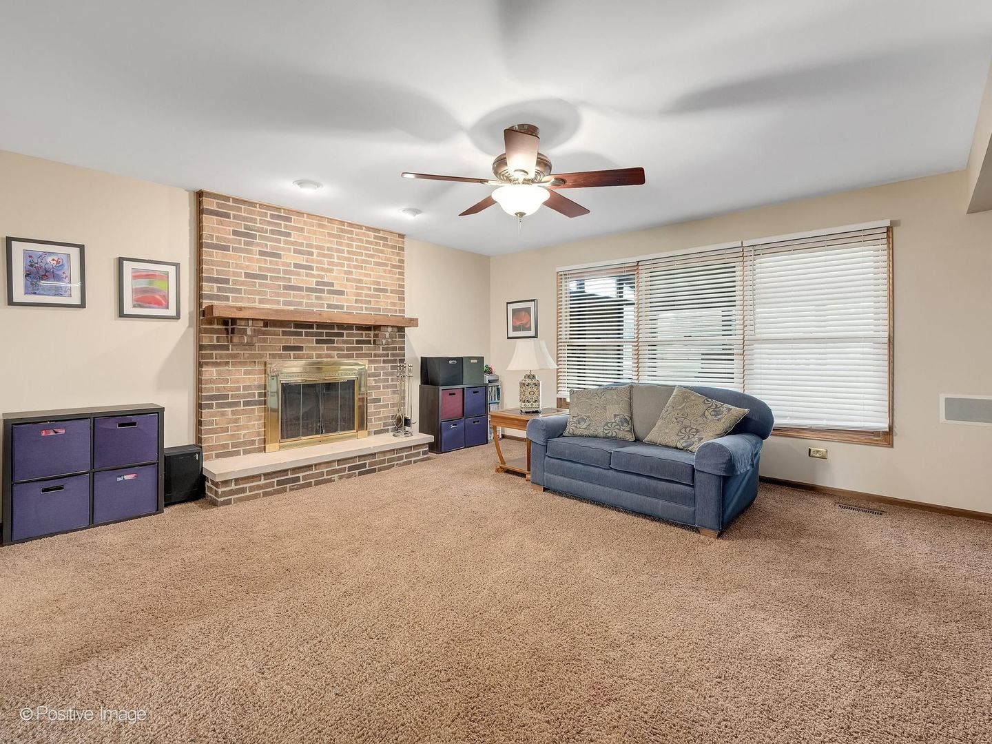 612 Stuart Drive Carol Stream, IL 60188 - Photo 6 of 29 a living room with furniture and a fireplace