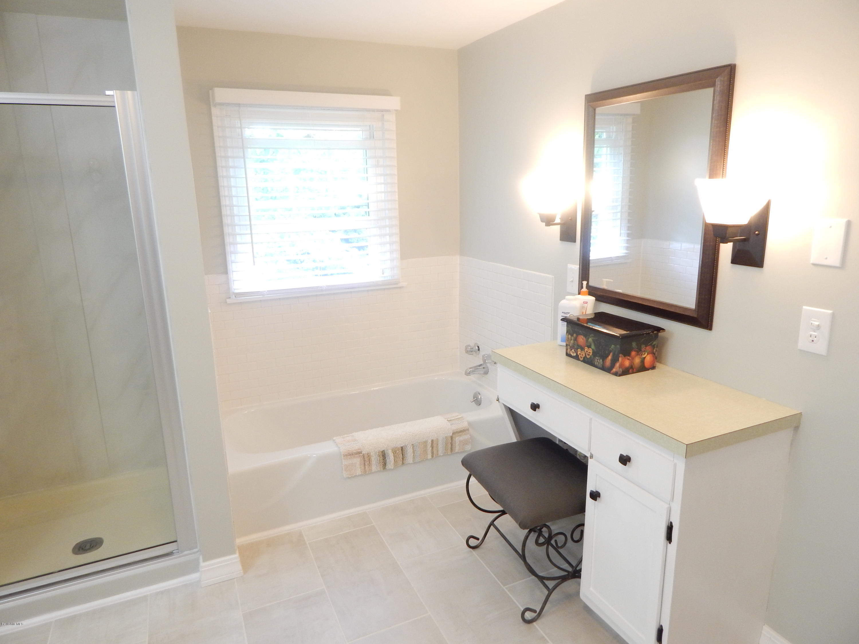 425 Devon Road Lee, MA 01238 - Photo 12 of 35 a bathroom with a bathtub sink and mirror