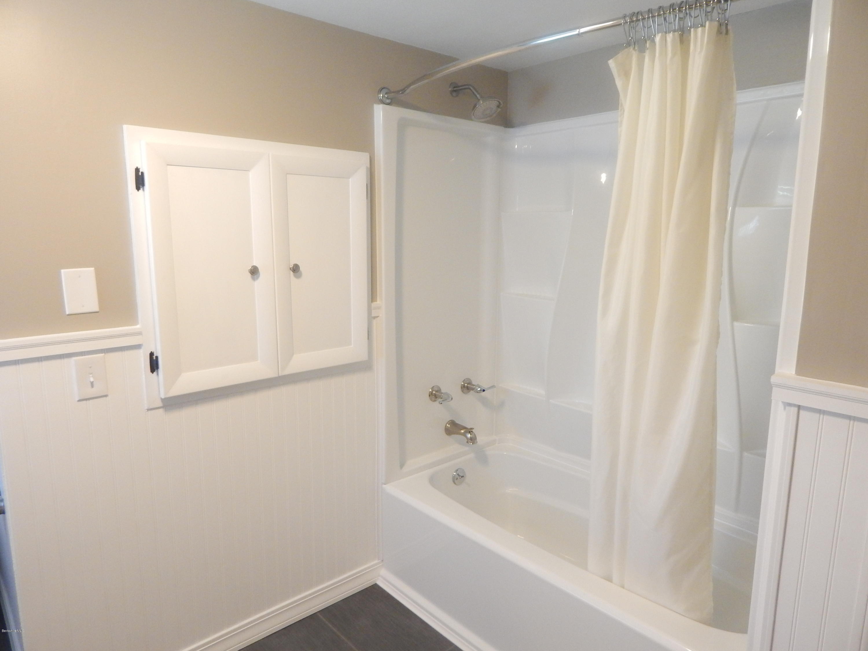 425 Devon Road Lee, MA 01238 - Photo 17 of 35 a bathroom with a bathtub and a shower