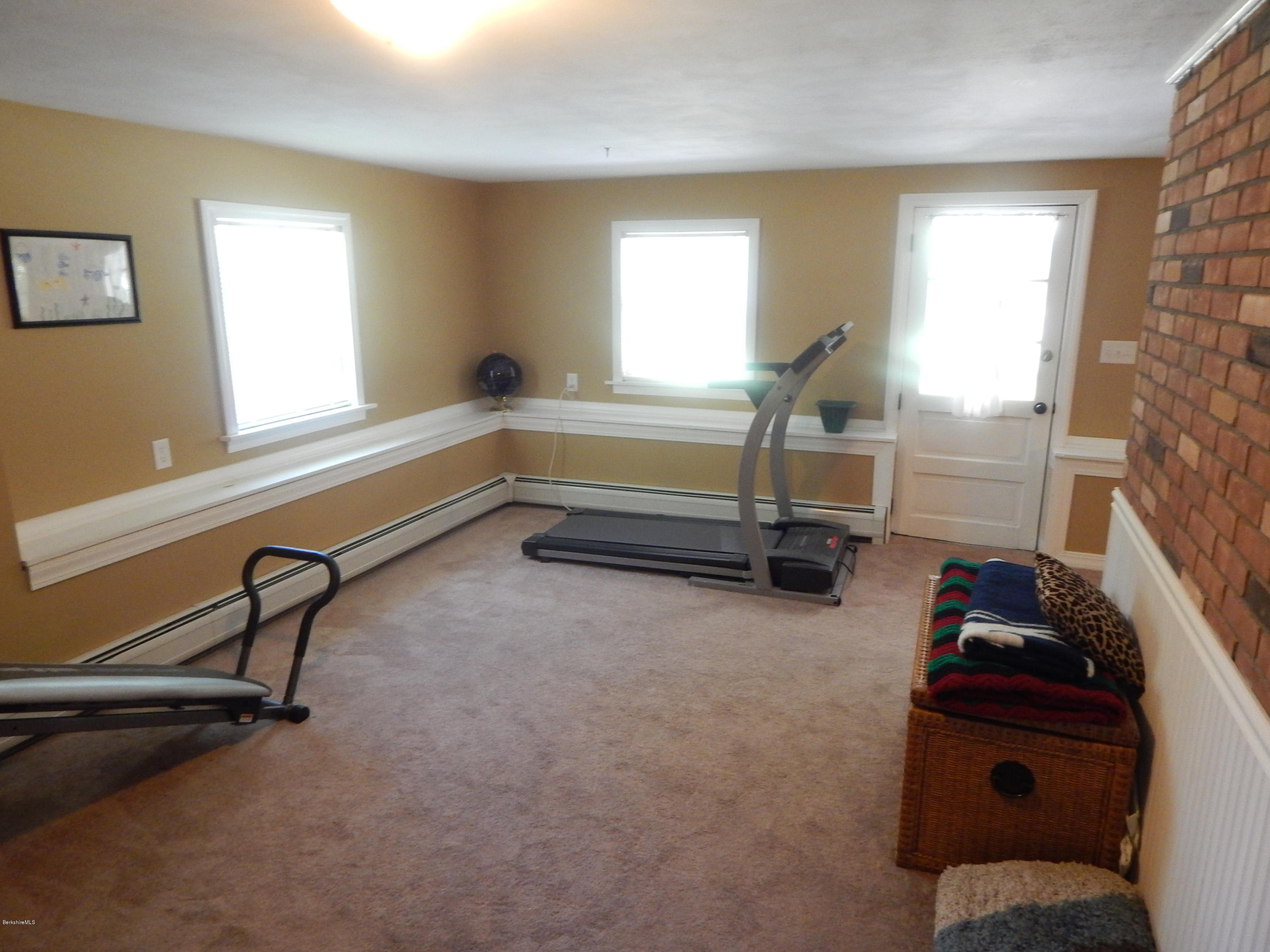 425 Devon Road Lee, MA 01238 - Photo 25 of 35 a room with gym equipment and a window