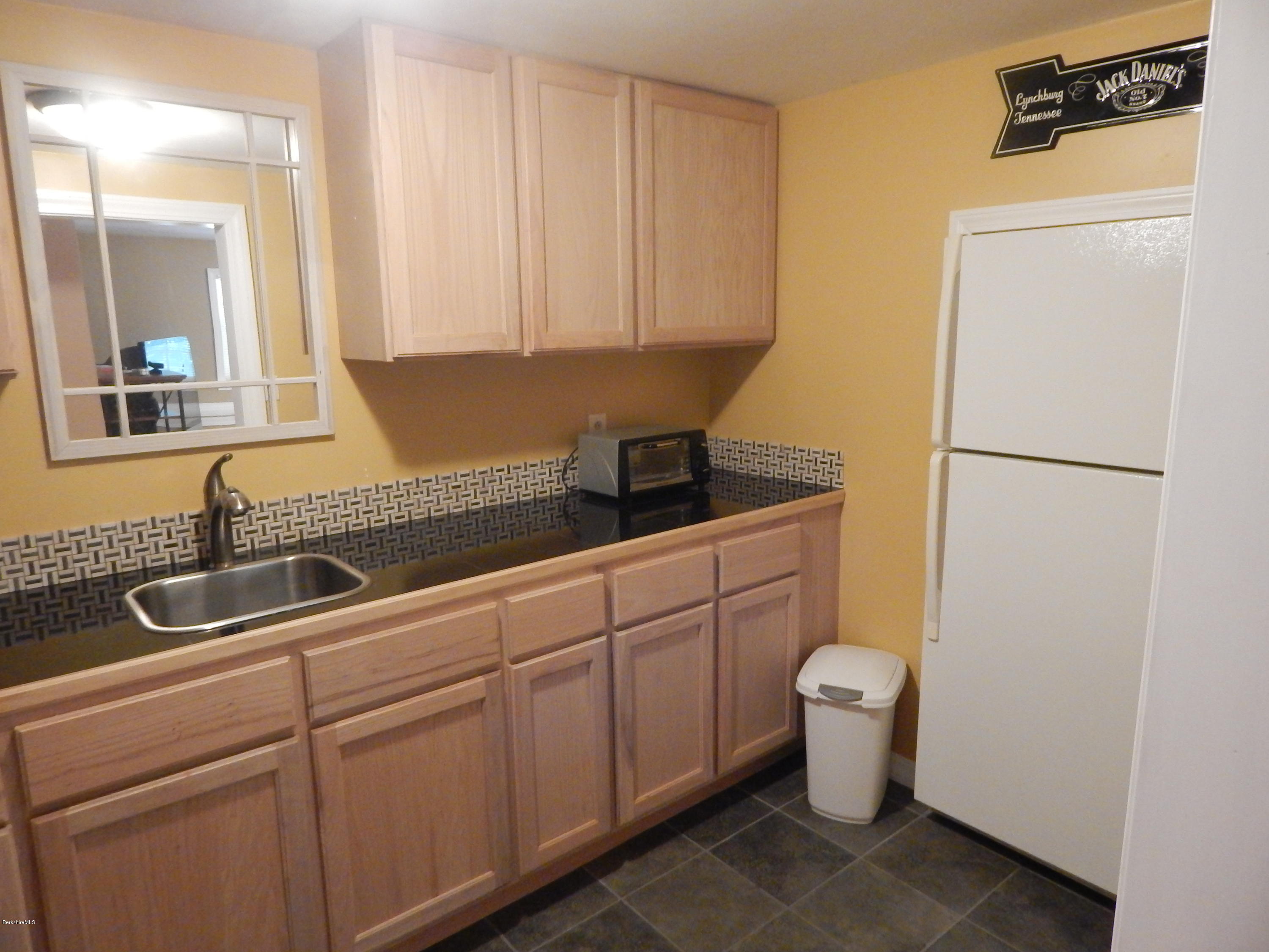 425 Devon Road Lee, MA 01238 - Photo 27 of 35 a bathroom with a sink toilet and mirror