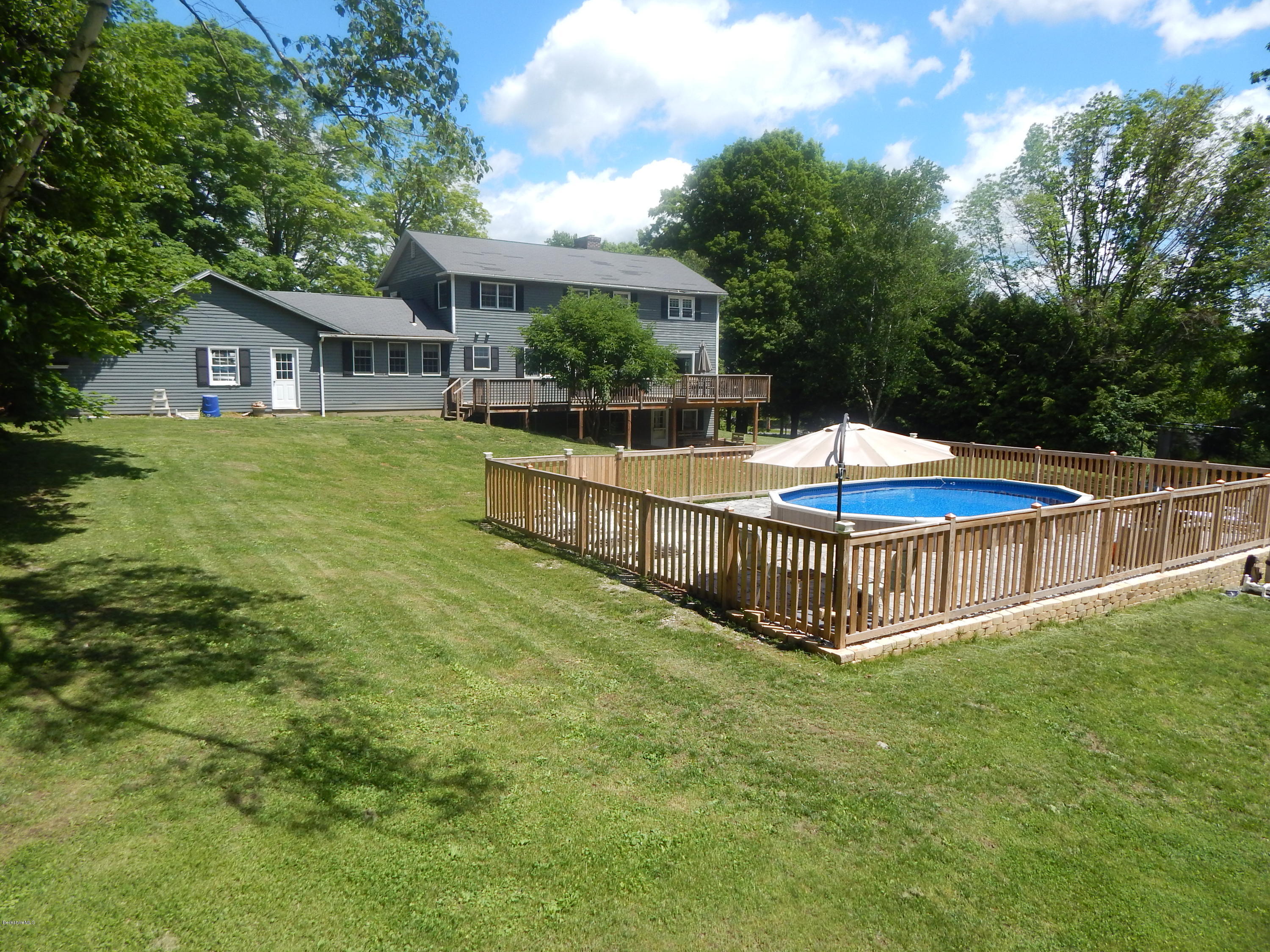 425 Devon Road Lee, MA 01238 - Photo 28 of 35 a view of a house with a yard and sitting area