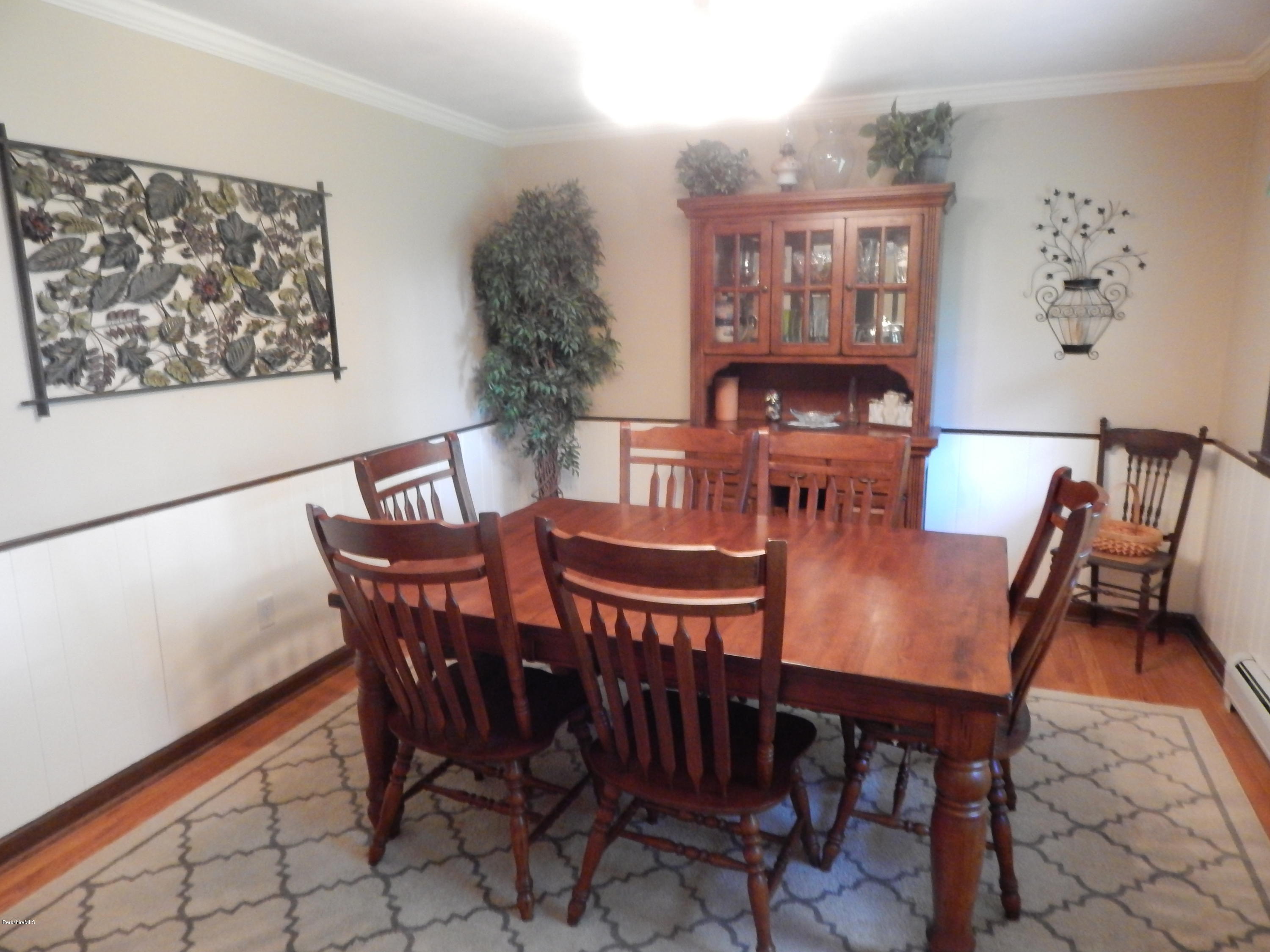 425 Devon Road Lee, MA 01238 - Photo 10 of 35 a view of a dining room with furniture