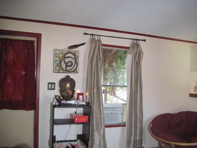 939 South Valley View Road, Unit 6 Ashland, OR 97520 - Photo 7 of 14 a room with a table and a mirror