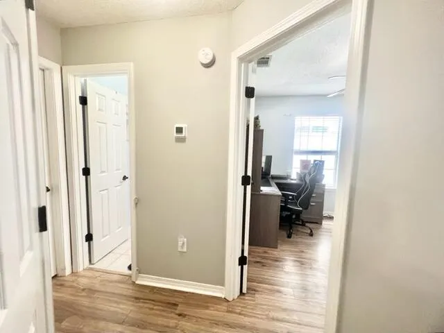 a view of a bathroom from a hallway