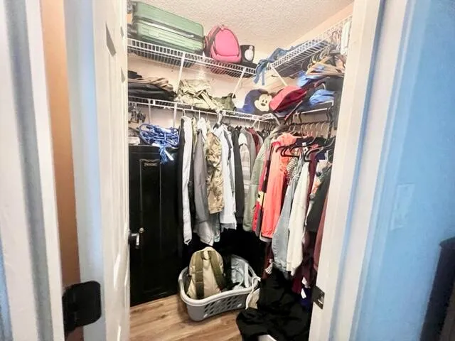 a view of a closet with storage and utility