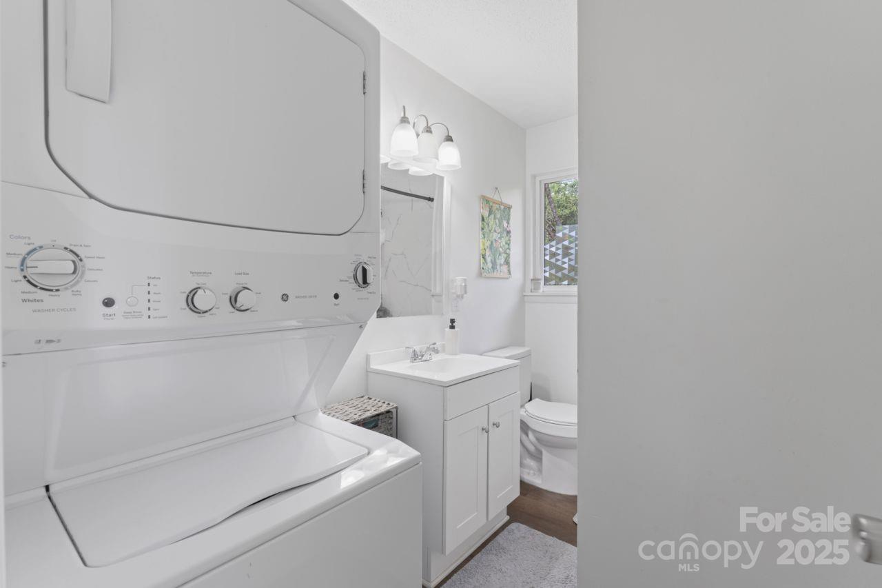 2403 Earley Circle Kannapolis, NC 28083 - Photo 15 of 21 a white toilet sitting next to a bathroom sink