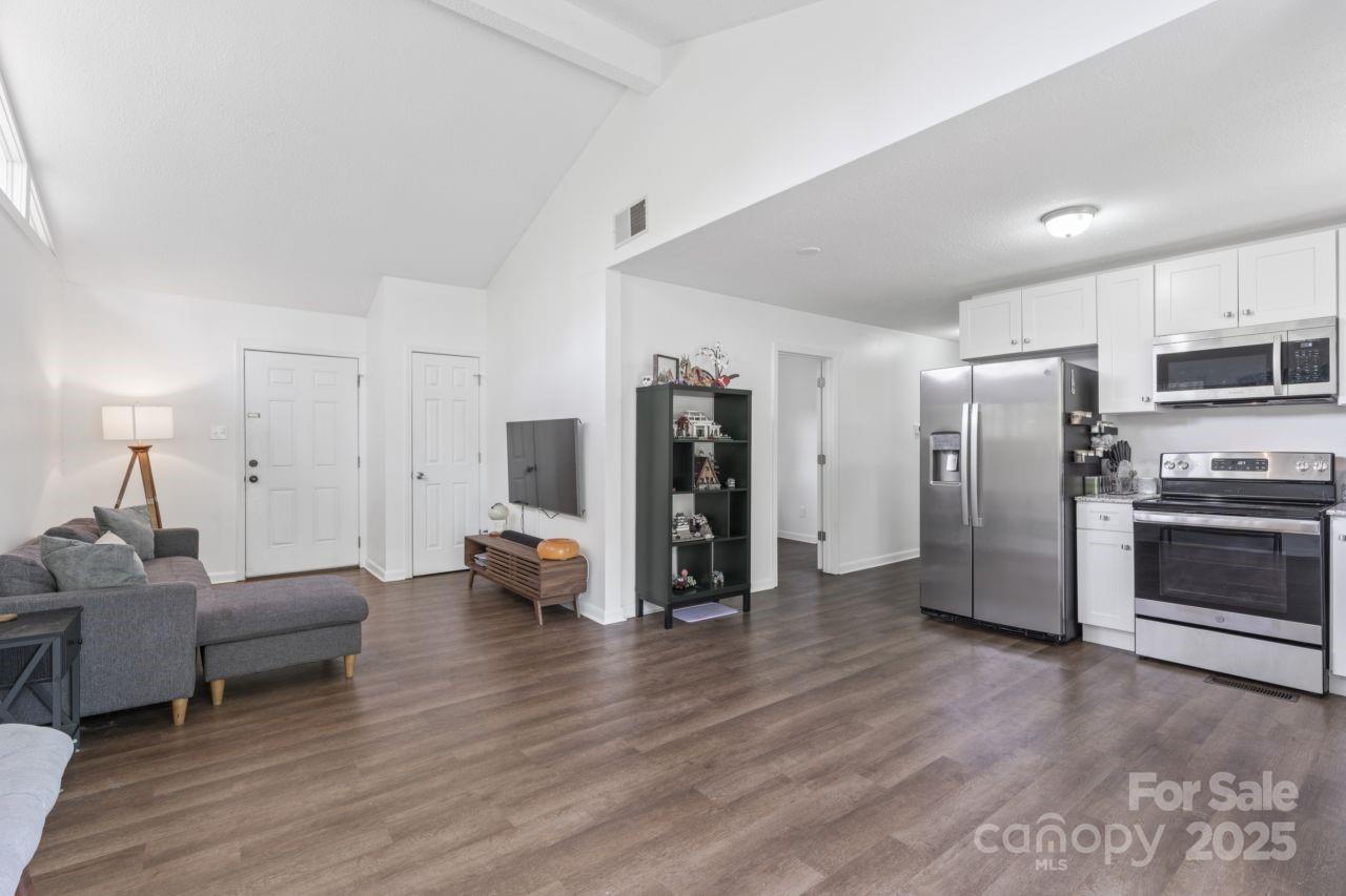 2403 Earley Circle Kannapolis, NC 28083 - Photo 5 of 21 a living room with furniture and a refrigerator