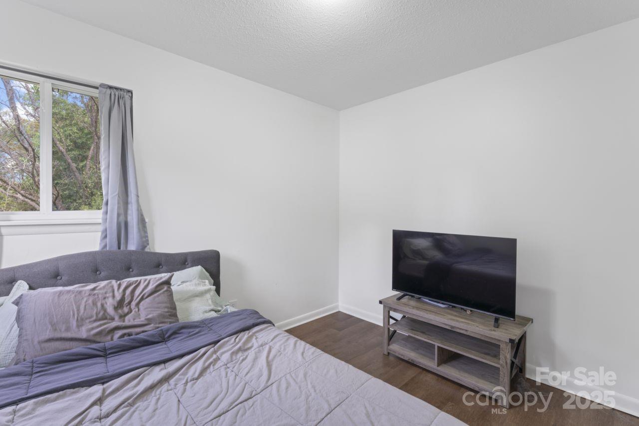 2403 Earley Circle Kannapolis, NC 28083 - Photo 10 of 21 a bedroom with a bed and a flat screen tv
