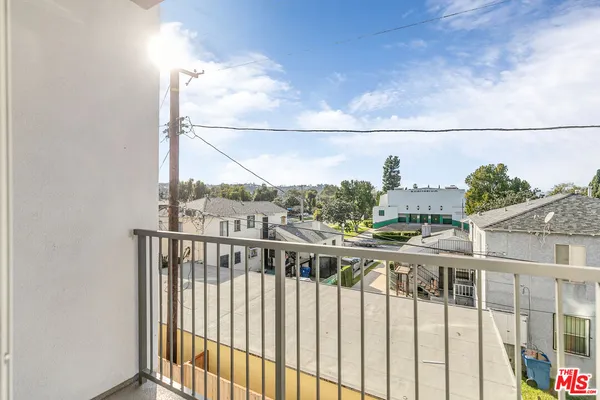 a view of a balcony with city view