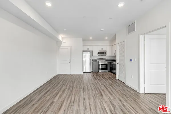 a view of kitchen with wooden floor