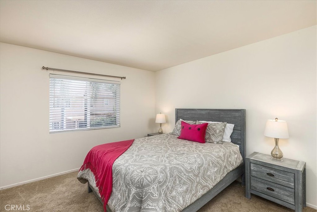 42064 Pine Needle Street Temecula, CA 92591 - Photo 19 of 39 a bedroom with a bed and a night stand