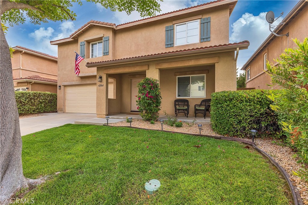 42064 Pine Needle Street Temecula, CA 92591 - Photo 2 of 39 front view of a house with a yard
