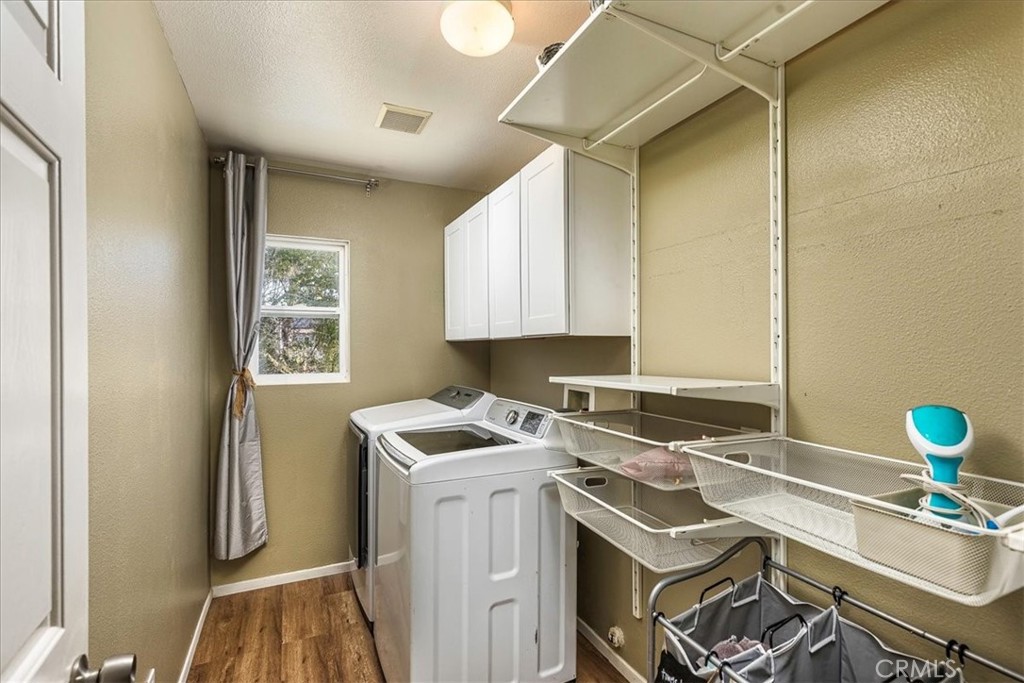 42064 Pine Needle Street Temecula, CA 92591 - Photo 23 of 39 a utility room with sink dryer and washer