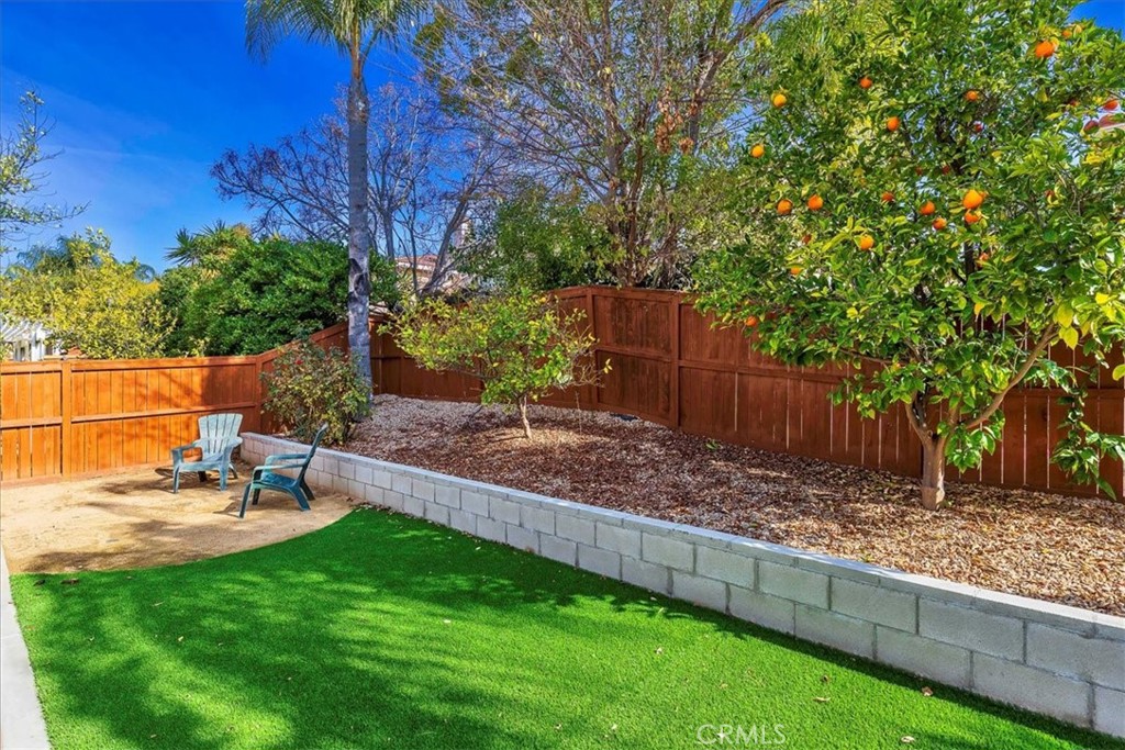 42064 Pine Needle Street Temecula, CA 92591 - Photo 29 of 39 a view of a backyard with sitting area