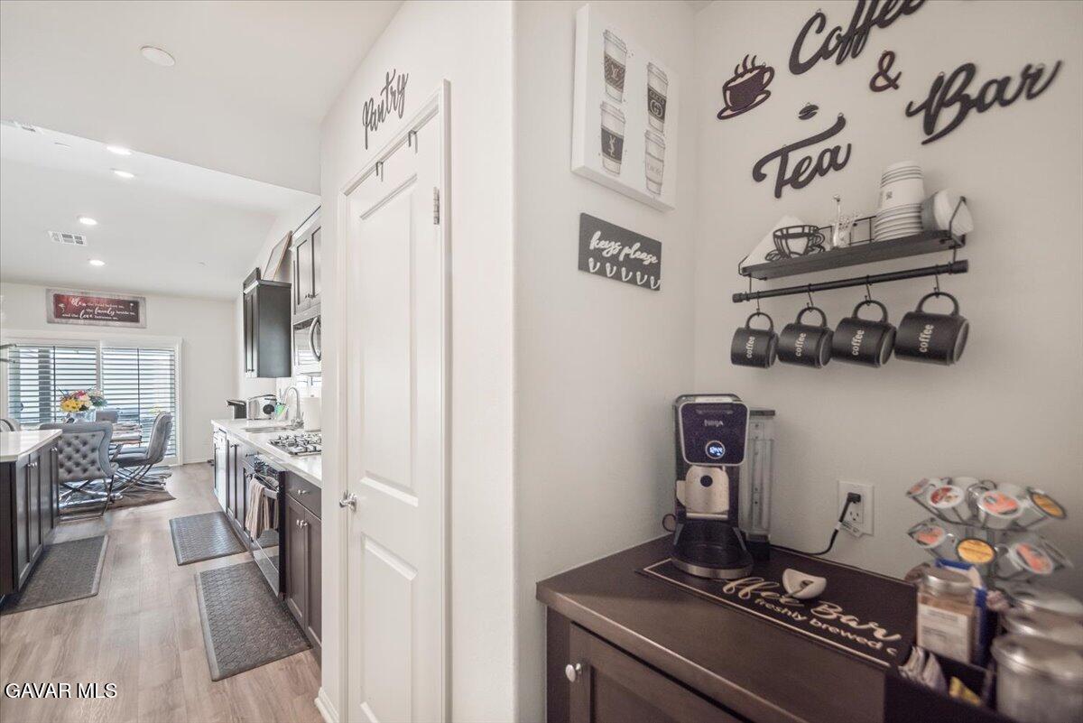 44304 43rd Street West Lancaster, CA 93536 - Photo 13 of 37 a kitchen with stainless steel appliances granite countertop a stove and cabinets