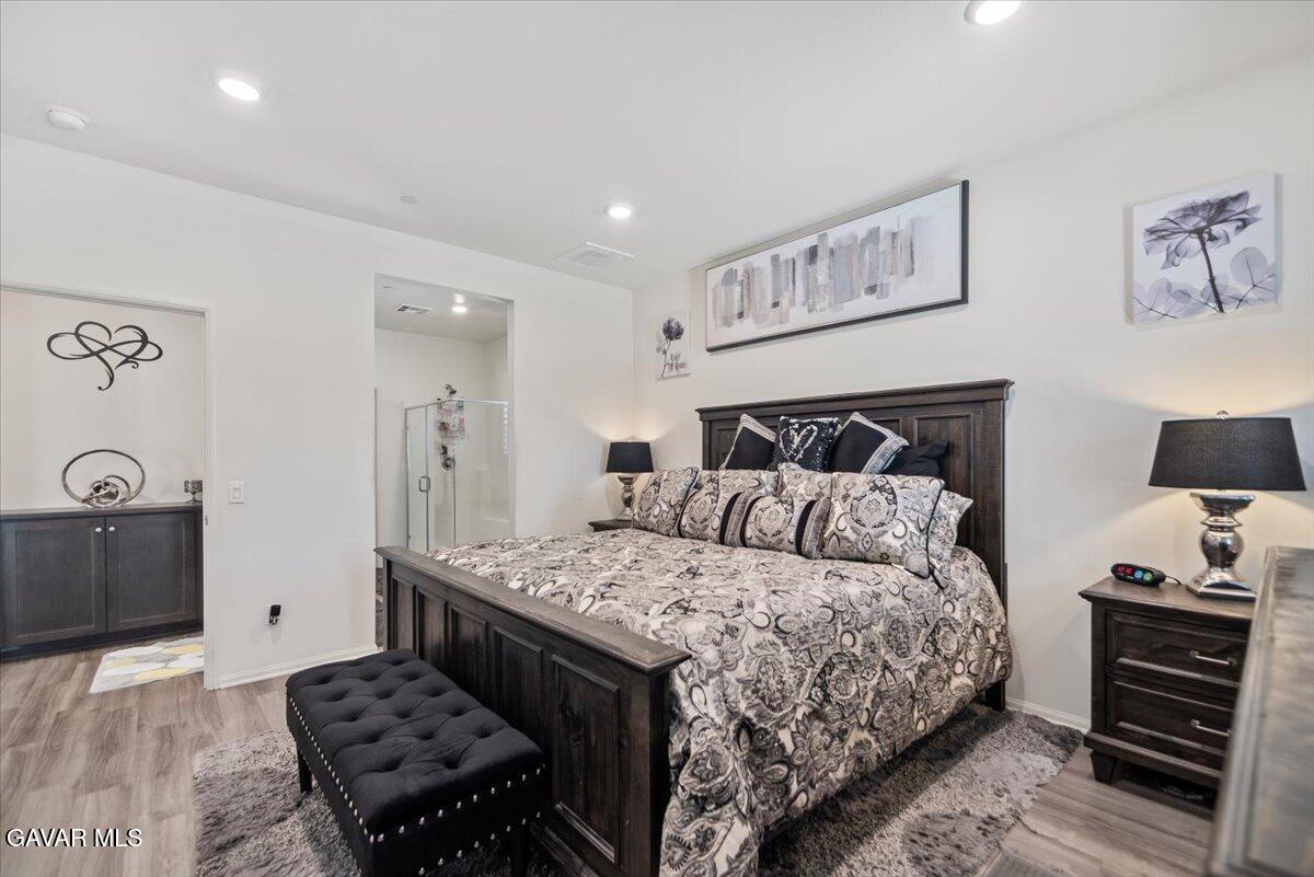 44304 43rd Street West Lancaster, CA 93536 - Photo 17 of 37 a bedroom with a bed and a dresser in it