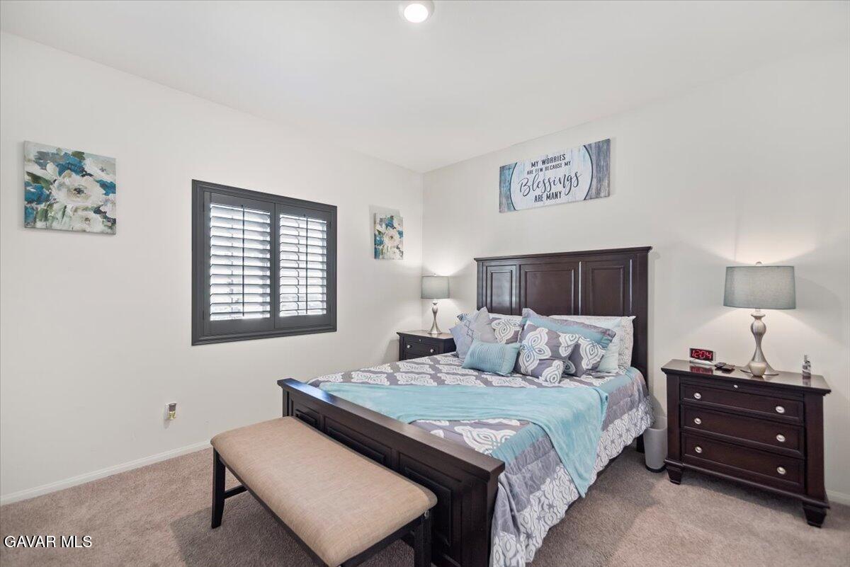 44304 43rd Street West Lancaster, CA 93536 - Photo 21 of 37 a bedroom with a bed and a window