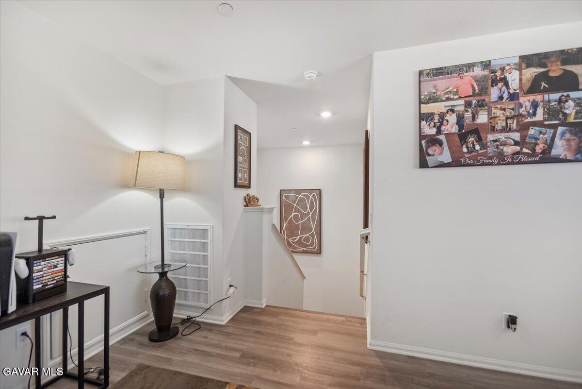 44304 43rd Street West Lancaster, CA 93536 - Photo 22 of 37 a view of a hallway with paintings on the wall