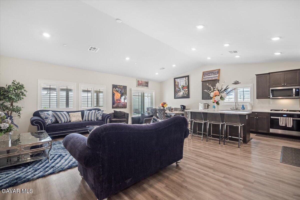 44304 43rd Street West Lancaster, CA 93536 - Photo 5 of 37 a living room with furniture a flat screen tv and a rug