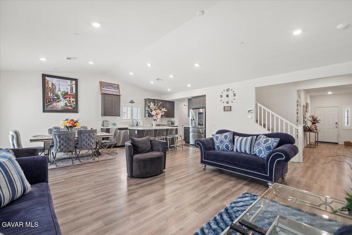 44304 43rd Street West Lancaster, CA 93536 - Photo 6 of 37 a living room with furniture or couch and a wooden floor