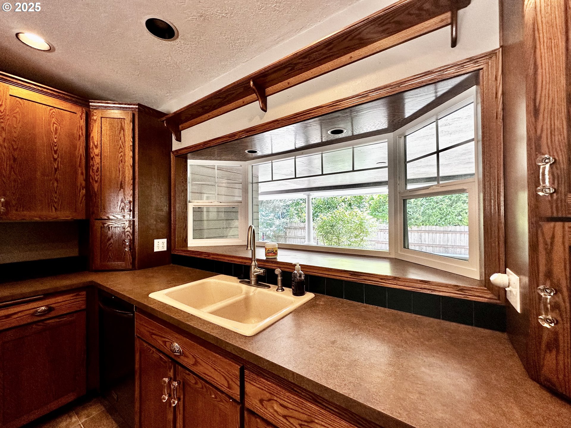 2453 Highway 20 Albany, OR 97321 - Photo 16 of 47 a kitchen with a large window and a sink