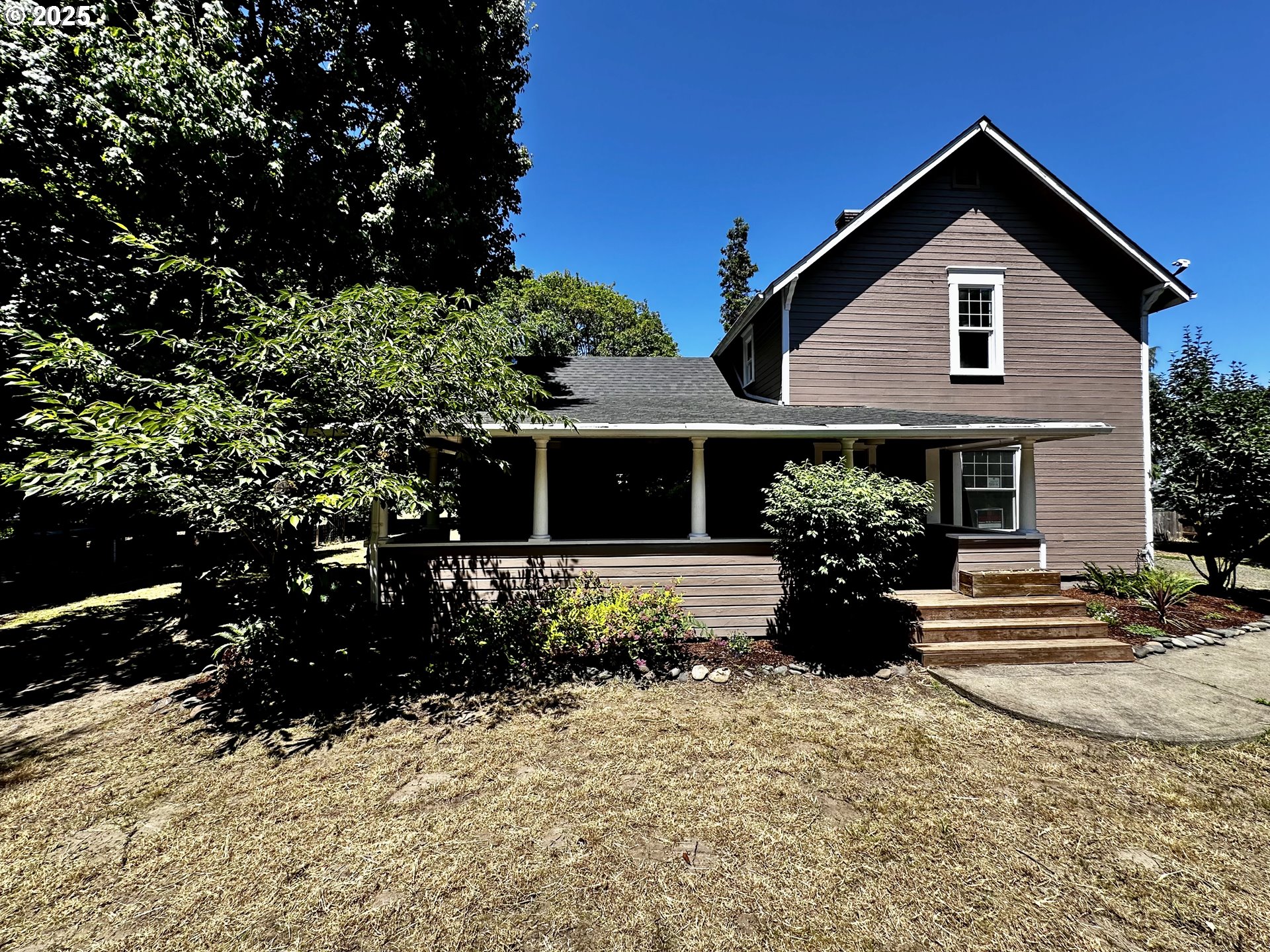 2453 Highway 20 Albany, OR 97321 - Photo 2 of 47 a front view of a house with a yard